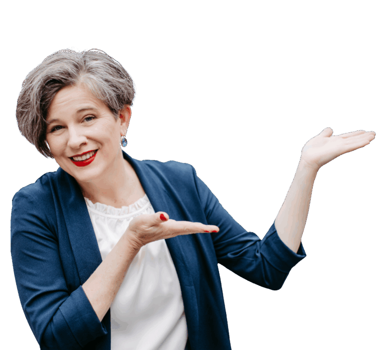 Katrin trägt eine weiße Bluse und einen dunkelblauen leichten Blazer. Ihre Hände deuten präsentierend nach rechts.